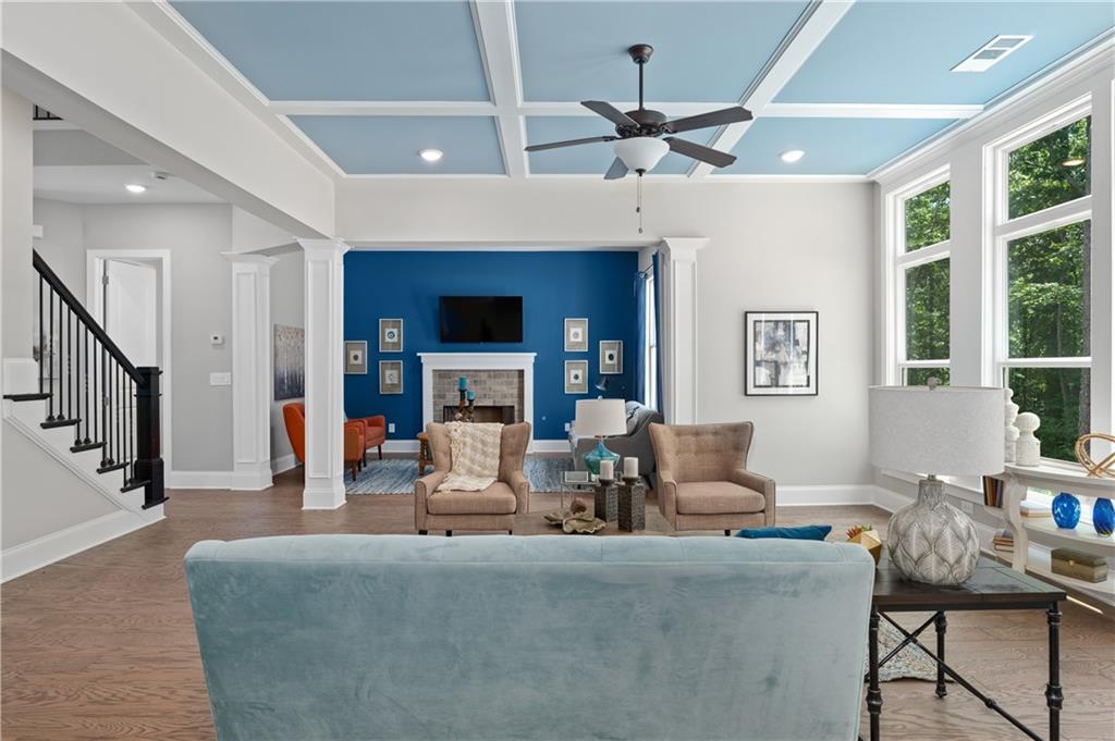 3710 Reserve Overlook Way Cumming, GA 30041 - Photo 24 of 98 a living room with fireplace furniture and a ceiling fan
