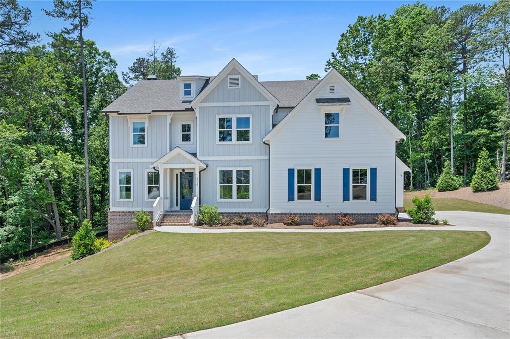 3710 Reserve Overlook Way Cumming, GA 30041 - Photo 3 of 98 a front view of house with yard and green space