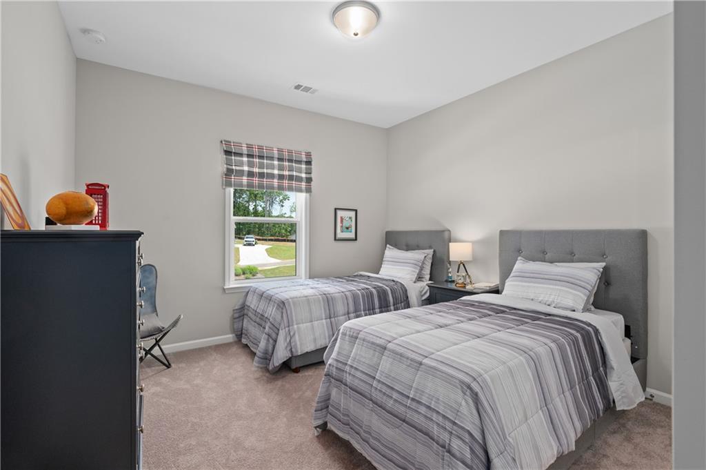 3710 Reserve Overlook Way Cumming, GA 30041 - Photo 38 of 98 a bedroom with two beds and a window