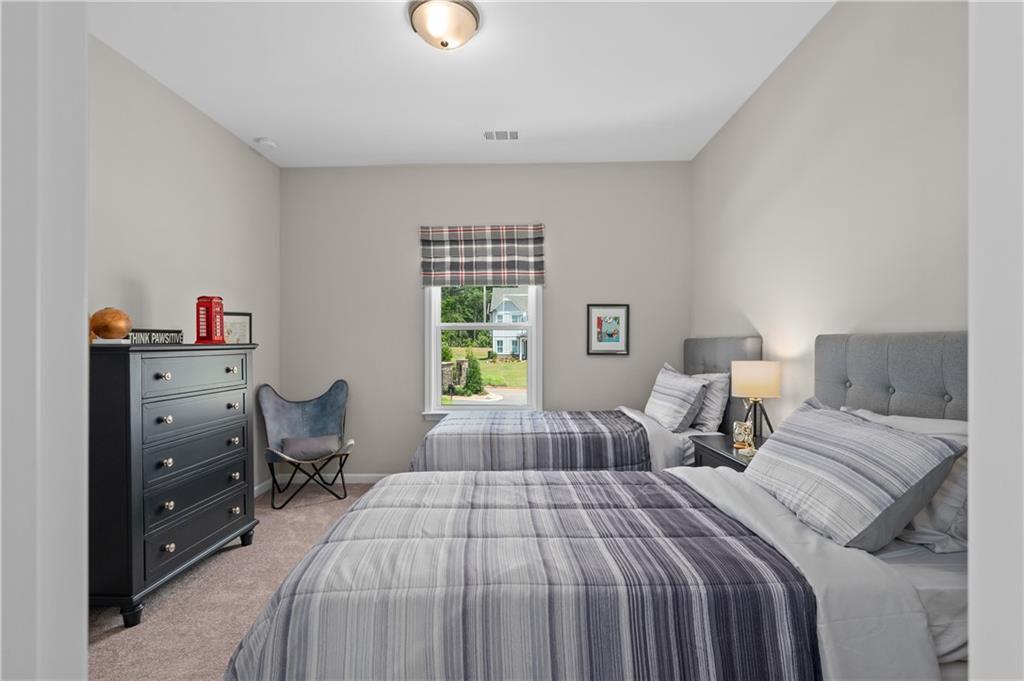 3710 Reserve Overlook Way Cumming, GA 30041 - Photo 39 of 98 a bedroom with a bed and a closet