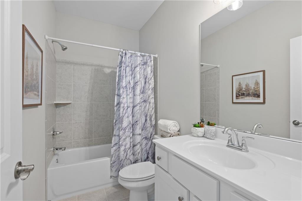 3710 Reserve Overlook Way Cumming, GA 30041 - Photo 50 of 98 a bathroom with a sink toilet and shower