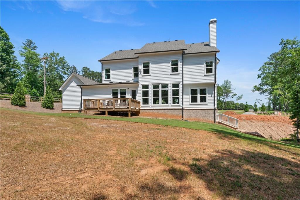 3710 Reserve Overlook Way Cumming, GA 30041 - Photo 62 of 98 a view of a house with large yard and large trees