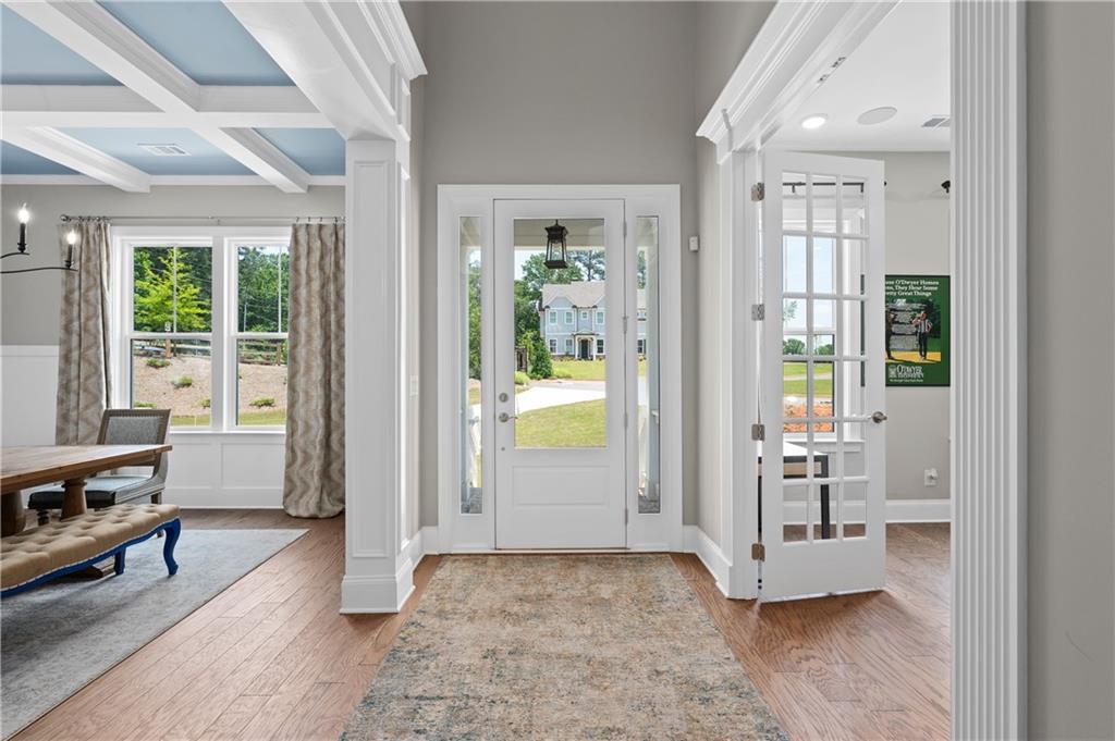 3710 Reserve Overlook Way Cumming, GA 30041 - Photo 8 of 98 a view of an entryway with wooden floor and a livingroom