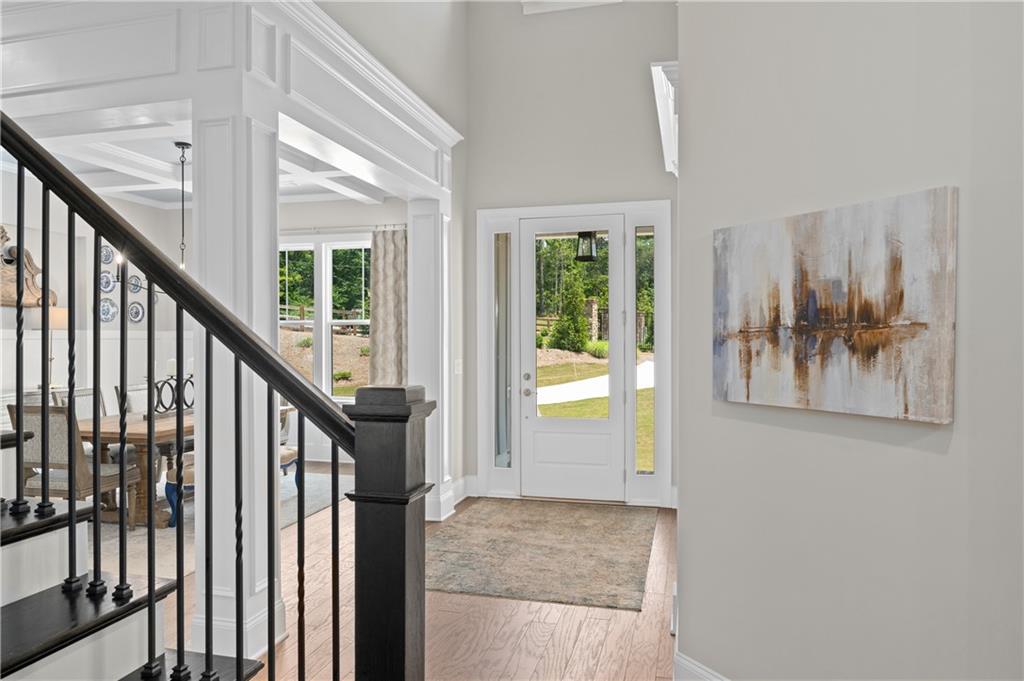 3710 Reserve Overlook Way Cumming, GA 30041 - Photo 9 of 98 a view of staircase with lots of frames on wall and a large window