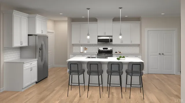 a kitchen with a table chairs refrigerator and microwave