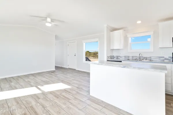 a view of kitchen with wooden floor