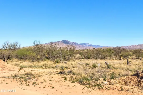 a view of mountain with a yard