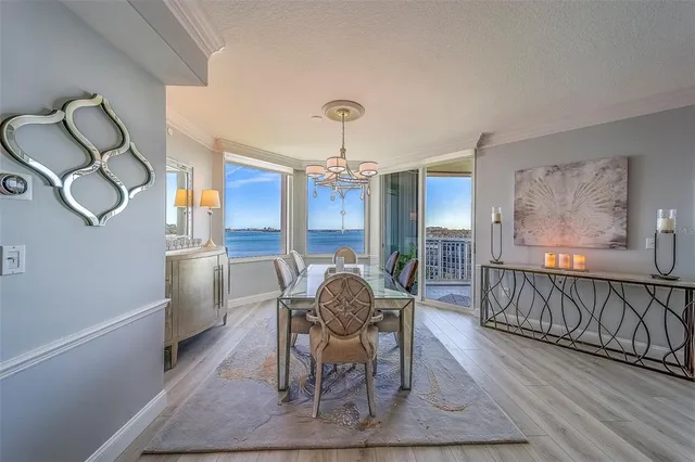 a kitchen with stainless steel appliances a refrigerator and cabinets