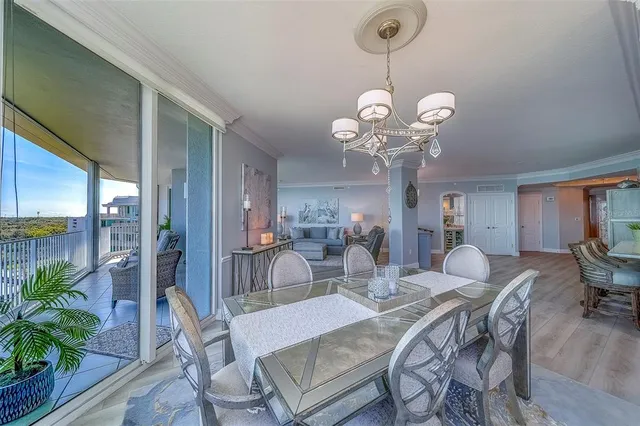 a large kitchen with stainless steel appliances granite countertop a lot of counter space and wooden floors