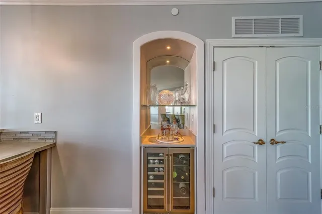 a bathroom with a granite countertop toilet and a shower
