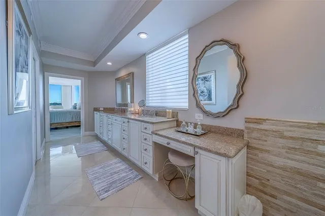 a view of a rooftop deck with dining table and chairs with wooden floor