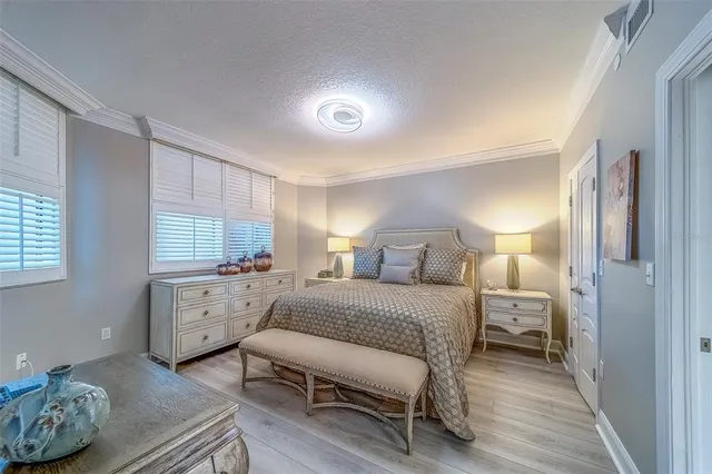 a view of a dining room with furniture wooden floor and chandelier