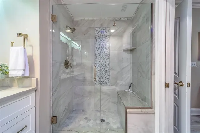 a kitchen with a dining table chairs and a refrigerator