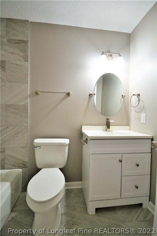 5201 Brookfield Road Fayetteville, NC 28303 - Photo 21 of 45 a bathroom with a toilet sink and mirror