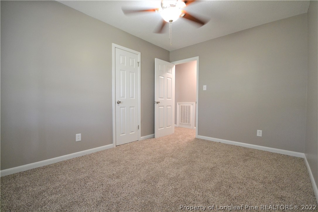 5201 Brookfield Road Fayetteville, NC 28303 - Photo 25 of 45 a view of an empty room with a chandelier fan