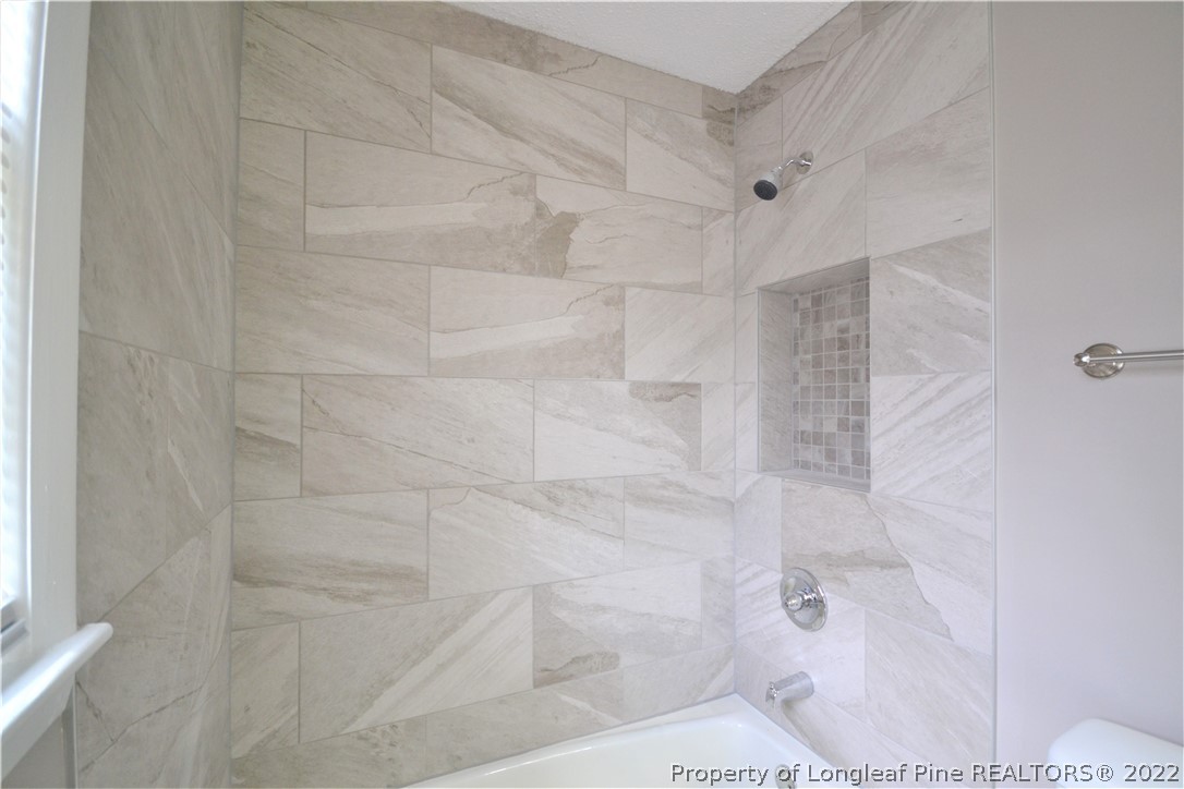 5201 Brookfield Road Fayetteville, NC 28303 - Photo 34 of 45 a bathroom with a shower