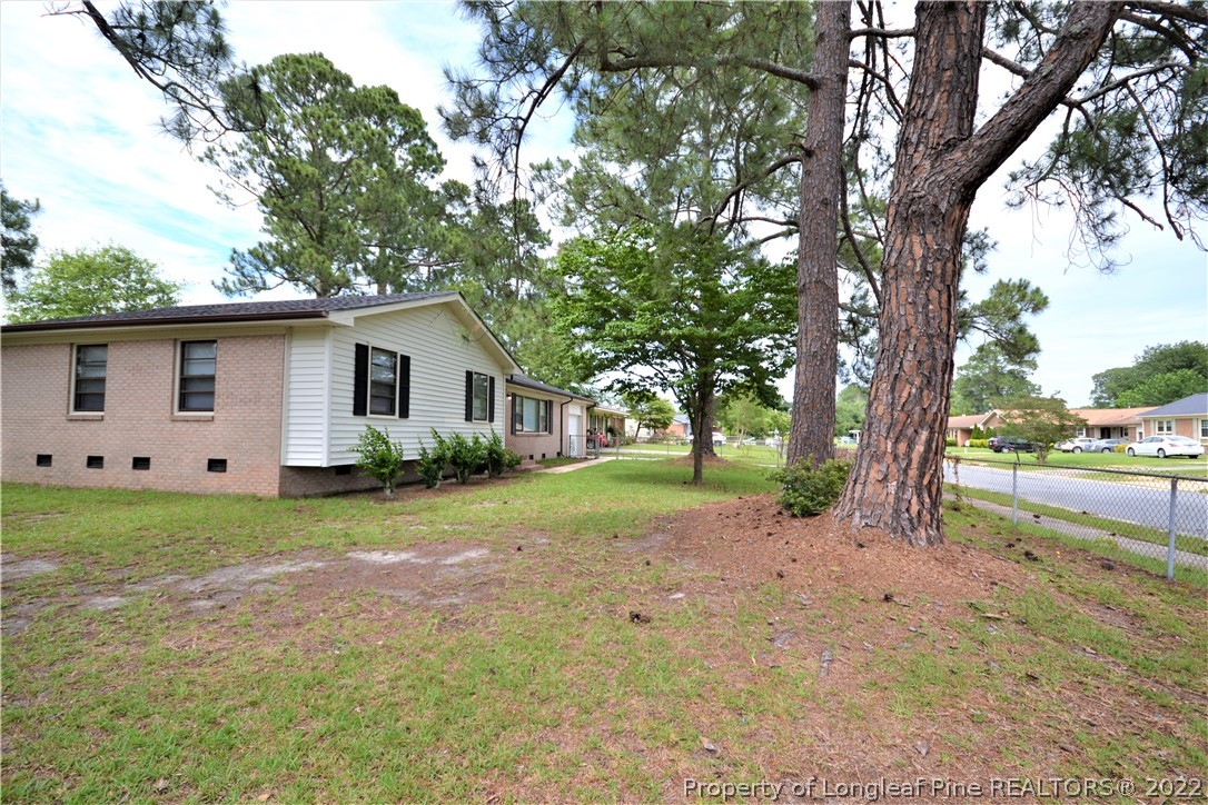 5201 Brookfield Road Fayetteville, NC 28303 - Photo 6 of 45 a view of a house with backyard and garden