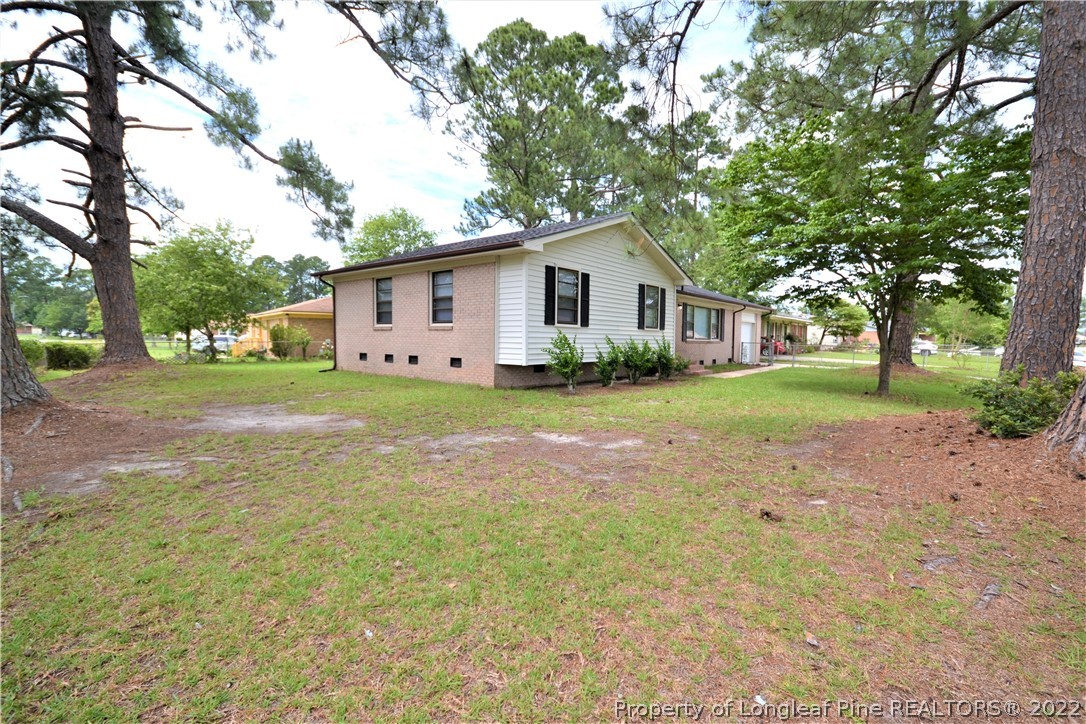 5201 Brookfield Road Fayetteville, NC 28303 - Photo 7 of 45 a view of a house with a yard