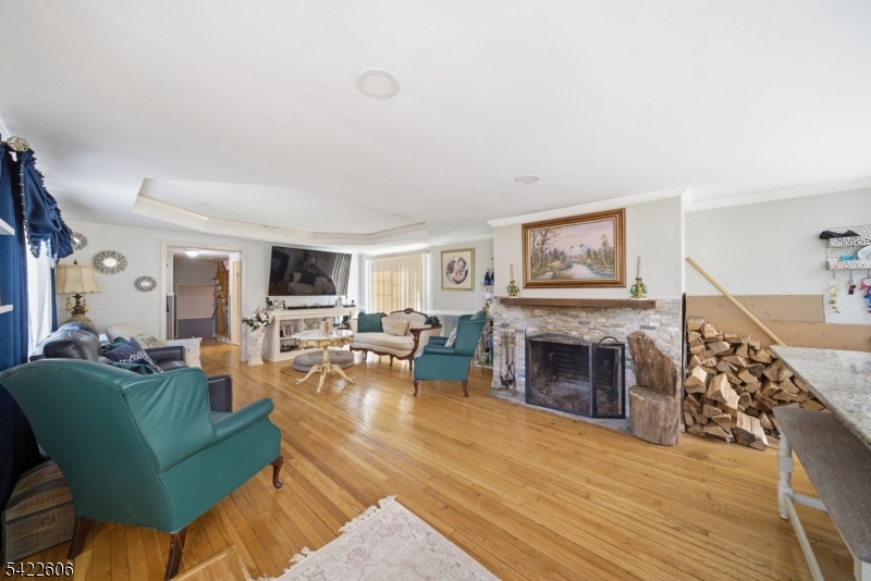399 Springbrook Trail Sparta, NJ 07871 - Photo 3 of 27 a living room with furniture and a fireplace