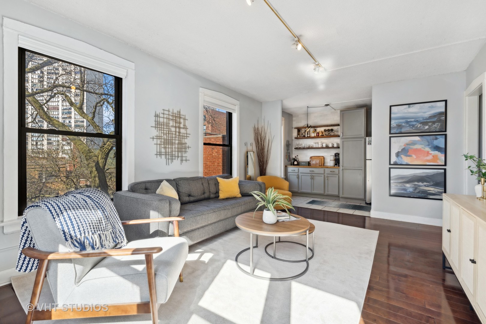 725 West Sheridan Road, Unit 501 Chicago, IL 60613 - Photo 3 of 11 a living room with furniture and a wooden floor