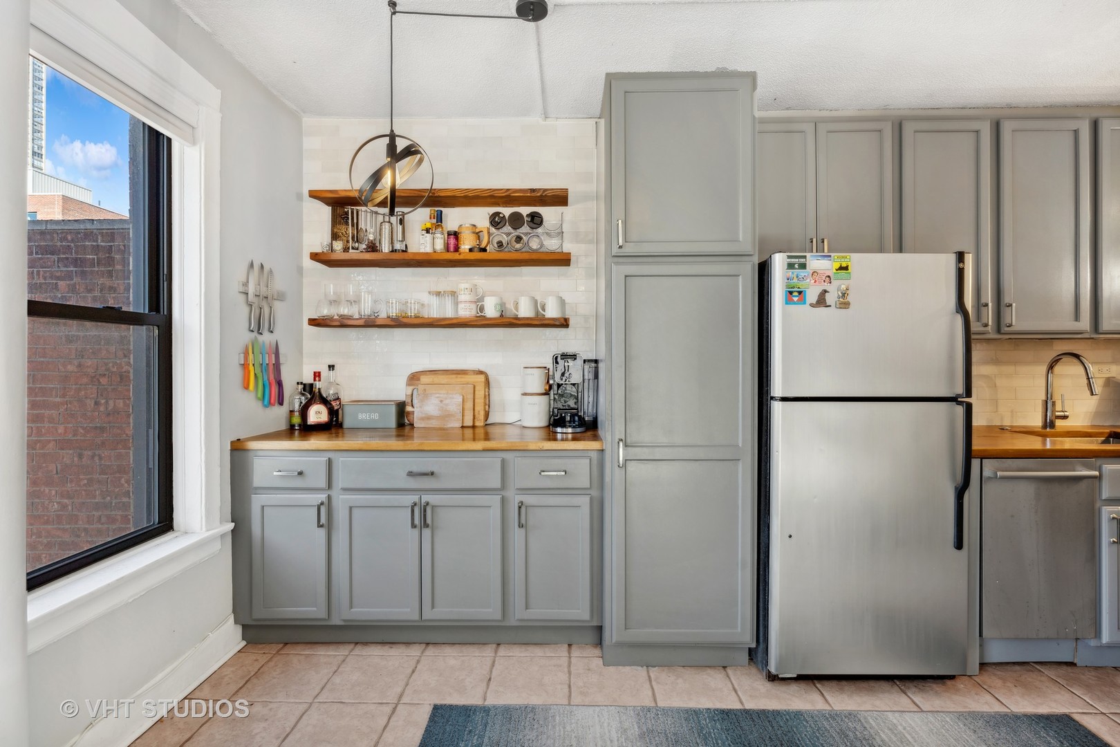 725 West Sheridan Road, Unit 501 Chicago, IL 60613 - Photo 4 of 11 a white refrigerator freezer sitting in a kitchen