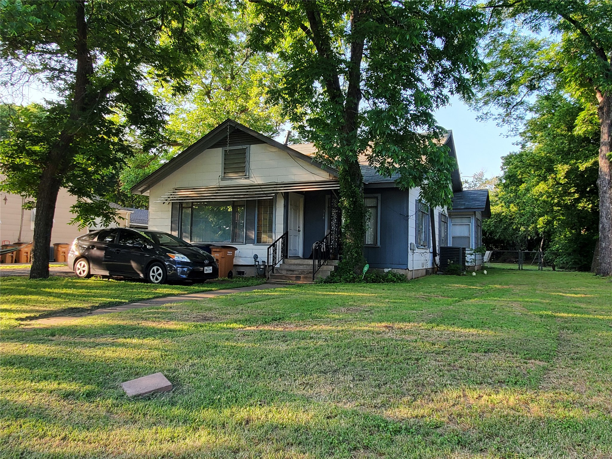 918 East 37th Street, Unit A Austin, TX 78705 - Photo 1 of 1 front view of a house with a yard