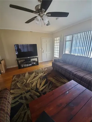 a bedroom with a bed and flat screen tv