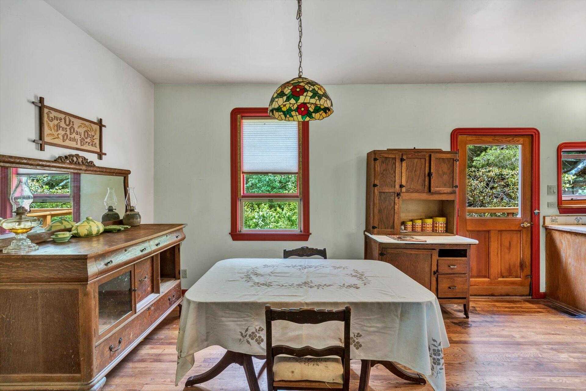 953 Huffville Road Northeast Pilot, VA 24138 - Photo 12 of 38 a view of a dining room with furniture window and wooden floor