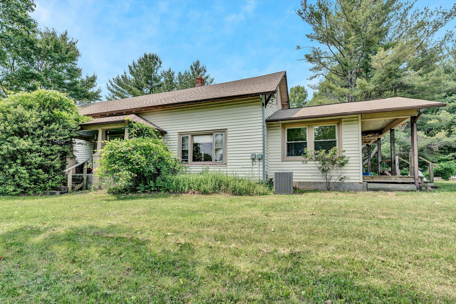 953 Huffville Road Northeast Pilot, VA 24138 - Photo 2 of 38 a view of a house with a yard