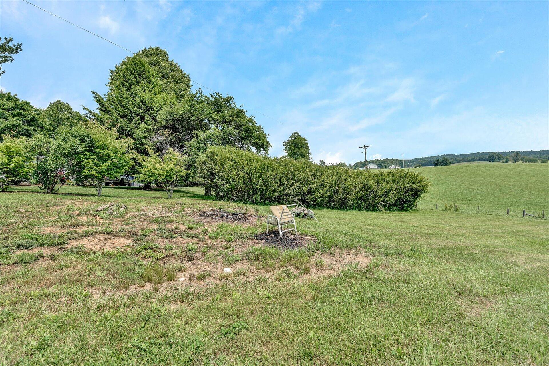 953 Huffville Road Northeast Pilot, VA 24138 - Photo 33 of 38 a big yard with lots of green space and plants