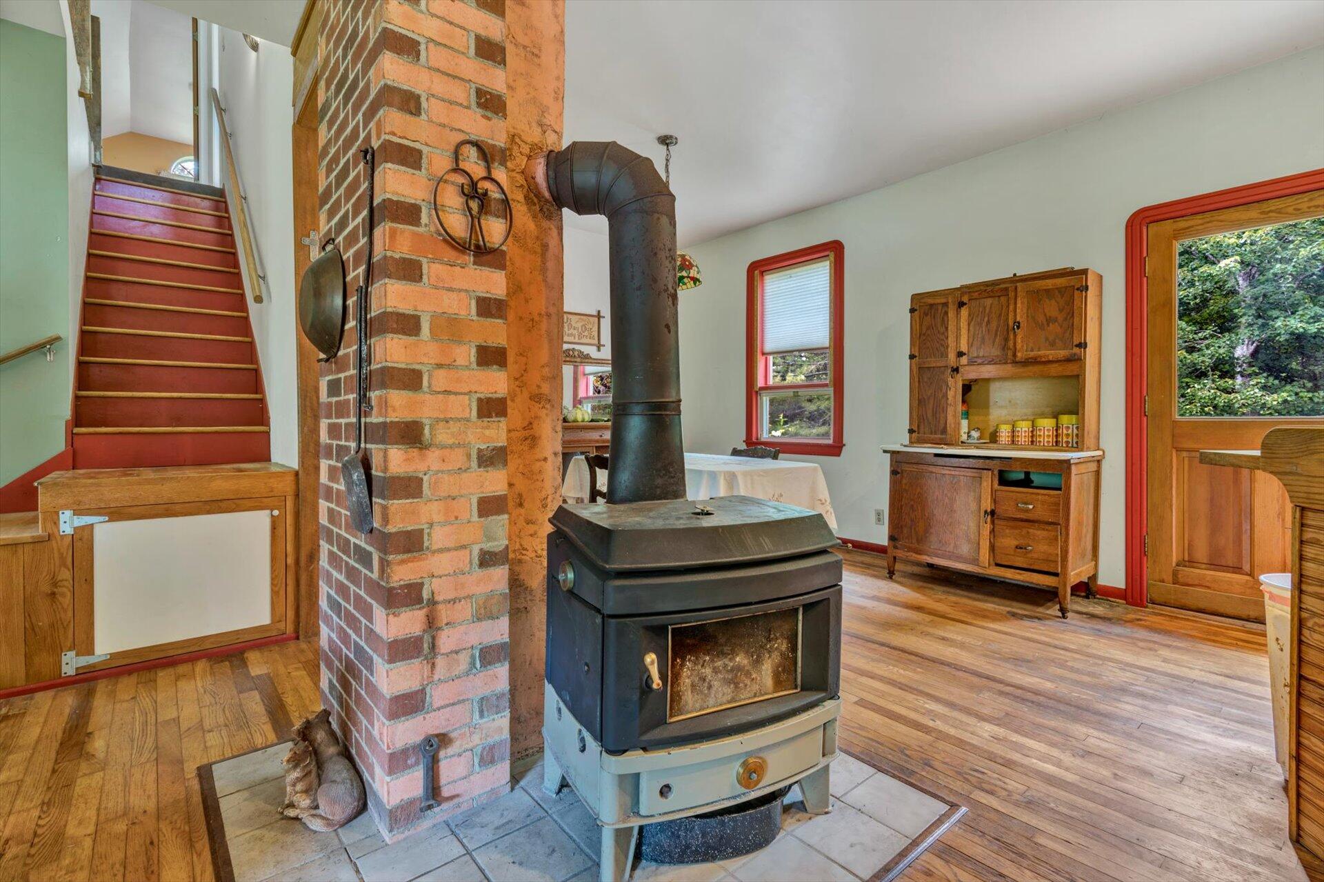 953 Huffville Road Northeast Pilot, VA 24138 - Photo 6 of 38 a living room with stainless steel appliances furniture a fireplace and wooden floor
