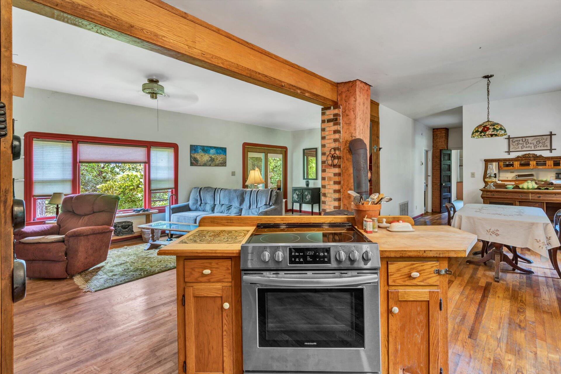 953 Huffville Road Northeast Pilot, VA 24138 - Photo 9 of 38 a kitchen view with a stove and a wooden floors