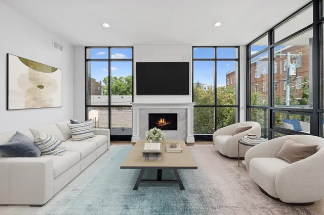 a kitchen with a refrigerator a sink and a stove top oven with wooden floor