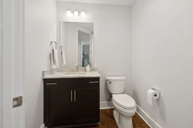 a balcony with furniture and a potted plant
