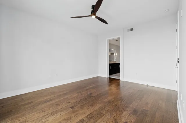 an aerial view of a house with garden space and sitting area