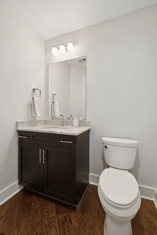 a view of a swimming pool with chairs and plants