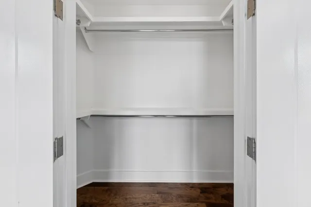 an aerial view of a house with garden space and sitting area