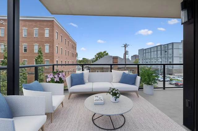 a dining room with a large window and table