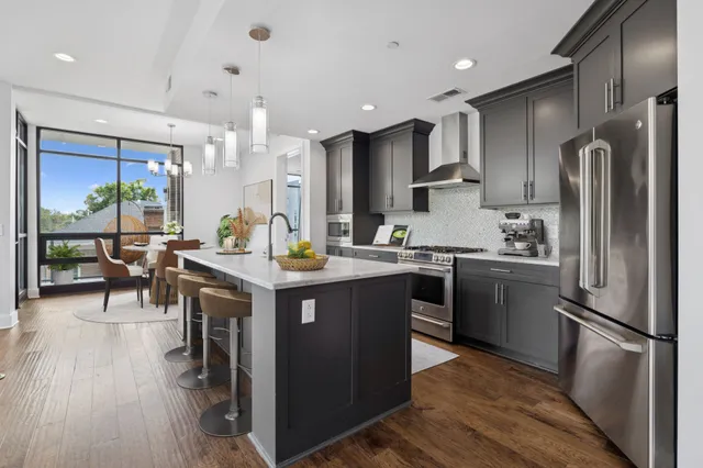 a living room with fireplace furniture and a flat screen tv