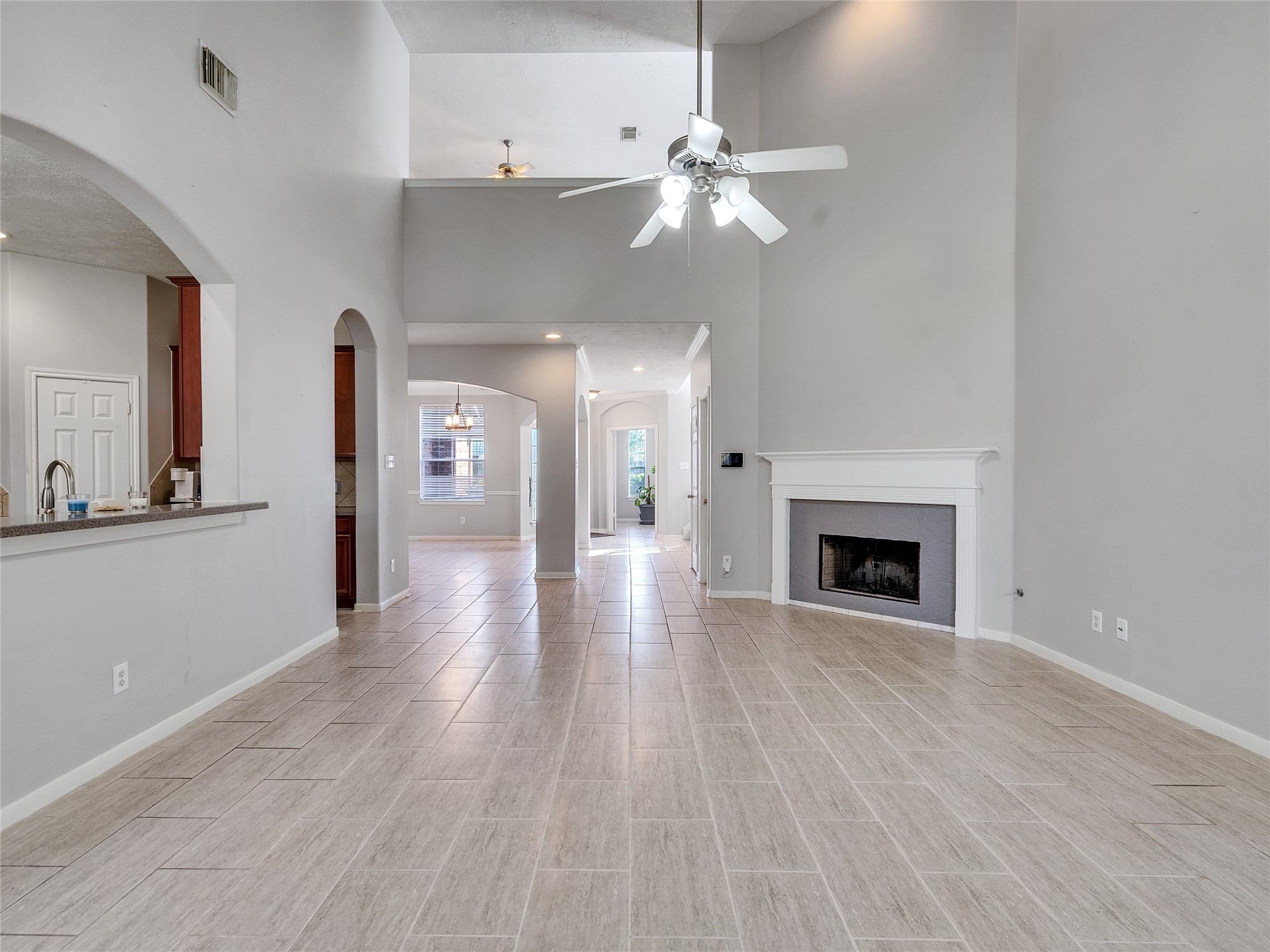 2615 Fern Lacy Drive Spring, TX 77388 - Photo 9 of 32 You just have to walk this house! This view displays the high ceiling at this location, the open kitchen concept, and second floor balcony.