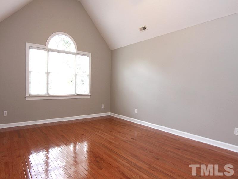 2617 Jasper Lane Raleigh, NC 27613 - Photo 14 of 25 wooden floor in an empty room with a window