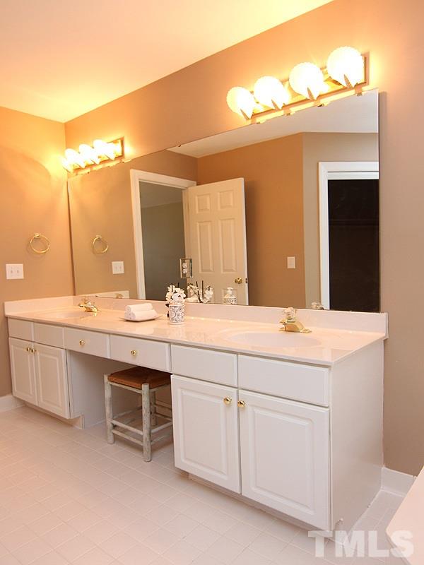 2617 Jasper Lane Raleigh, NC 27613 - Photo 16 of 25 a bathroom with a sink and a mirror