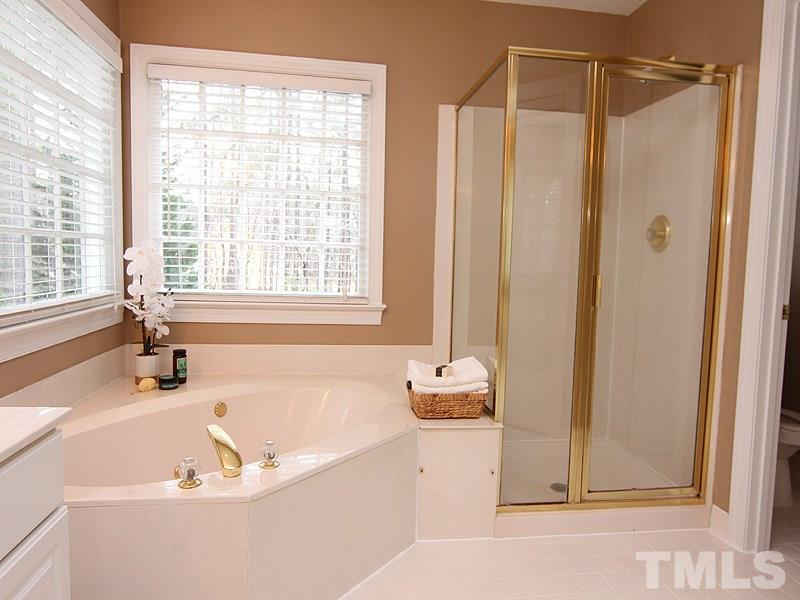 2617 Jasper Lane Raleigh, NC 27613 - Photo 17 of 25 a bath tub sitting next to a window