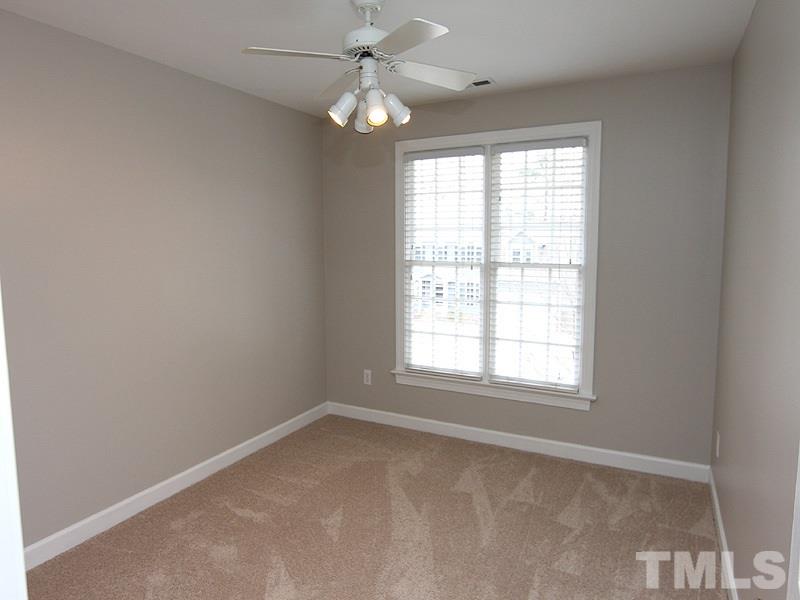 2617 Jasper Lane Raleigh, NC 27613 - Photo 18 of 25 an empty room with a window and a fan