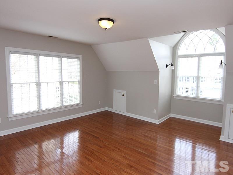 2617 Jasper Lane Raleigh, NC 27613 - Photo 21 of 25 an empty room with wooden floor and windows