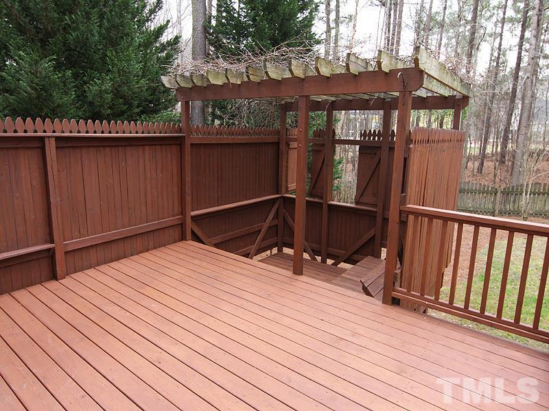 2617 Jasper Lane Raleigh, NC 27613 - Photo 23 of 25 a view of backyard with wooden deck and outdoor seating
