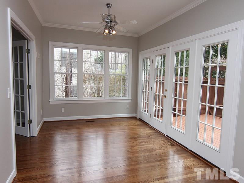 2617 Jasper Lane Raleigh, NC 27613 - Photo 9 of 25 a view of an empty room with wooden floor and a window