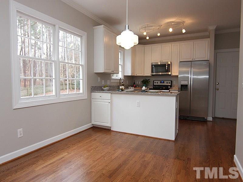 2617 Jasper Lane Raleigh, NC 27613 - Photo 10 of 25 a kitchen with stainless steel appliances granite countertop a refrigerator a sink dishwasher a stove and a refrigerator