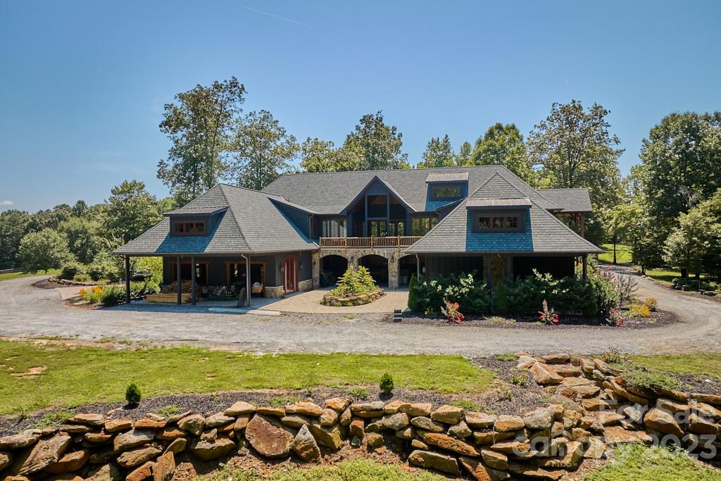 800 Collinsville Road Columbus, NC 28722 - Photo 11 of 33 a front view of a house with swimming pool garden and patio