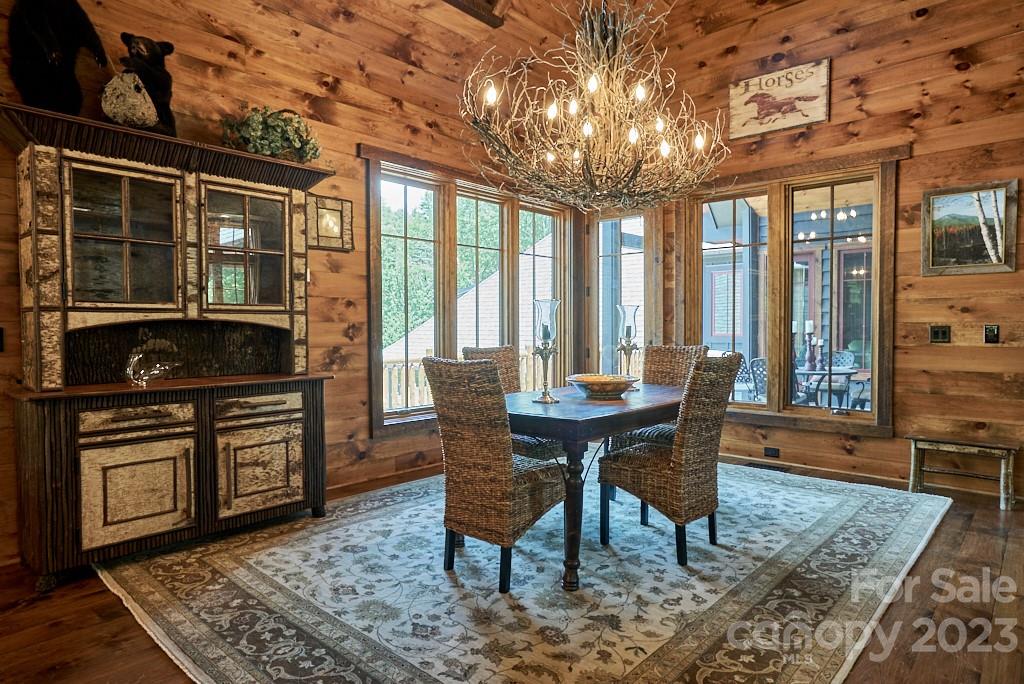 800 Collinsville Road Columbus, NC 28722 - Photo 20 of 33 a view of a dining room with furniture window and wooden floor